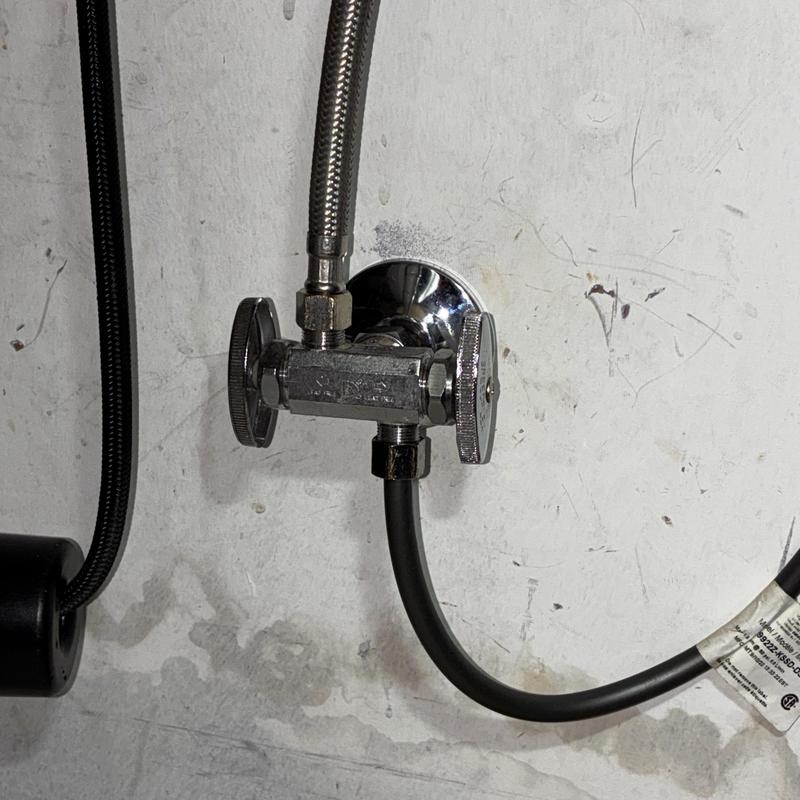 Dual angle stop valve with hoses installed on wall
