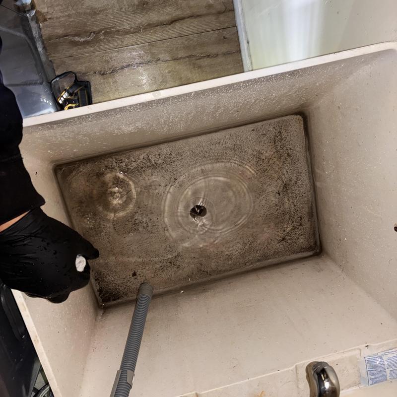 Laundry sink drain clearing with clog removal