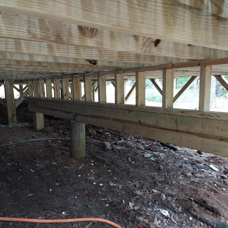 Deck framing and support posts under new deck boards Deck framing and support posts under new deck boards