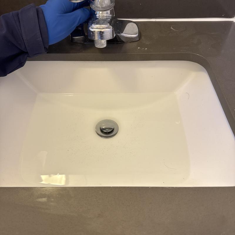 Basin drain clearing with hand crank in bathroom sink