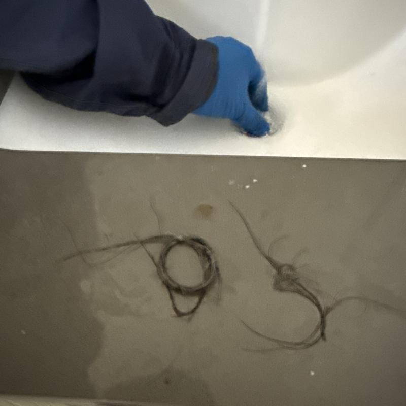 Basin drain clearing with hair removal and hand crank