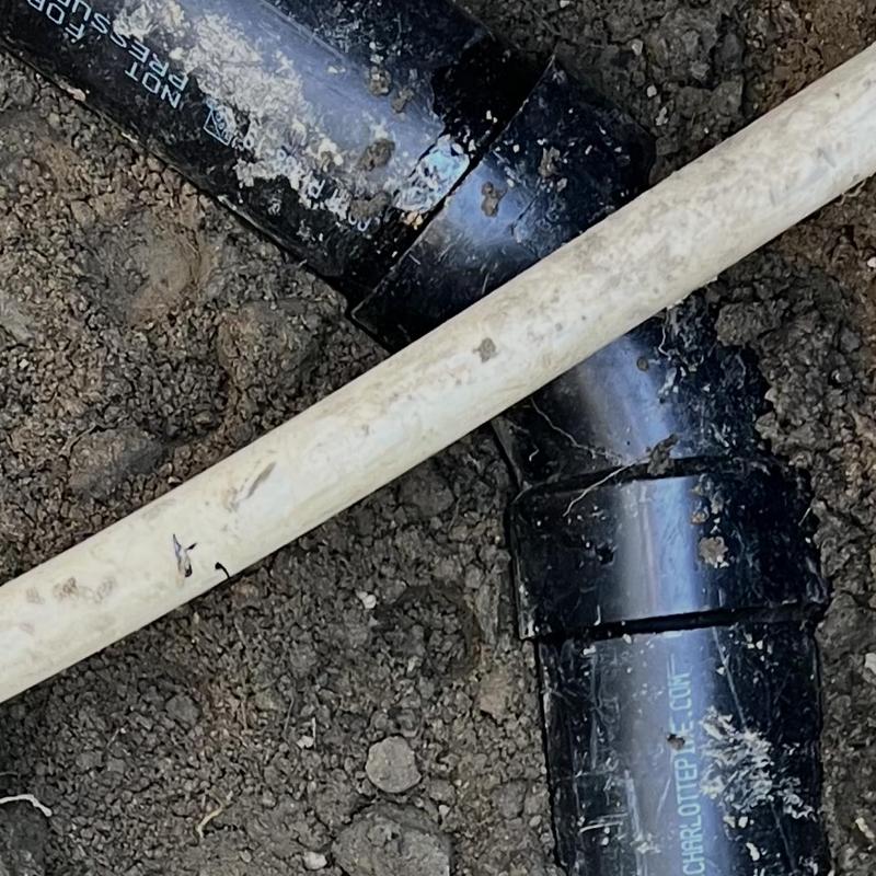 Main sewer line cracked pipe repair in dirt