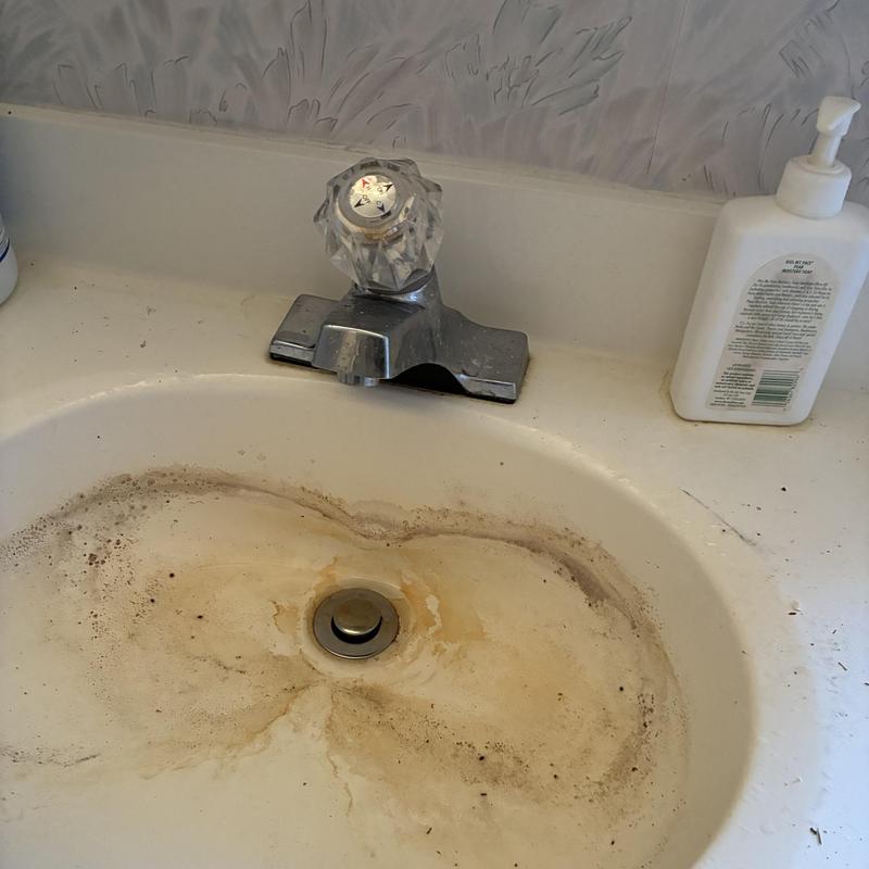 Basin faucet with dirty sink and countertop