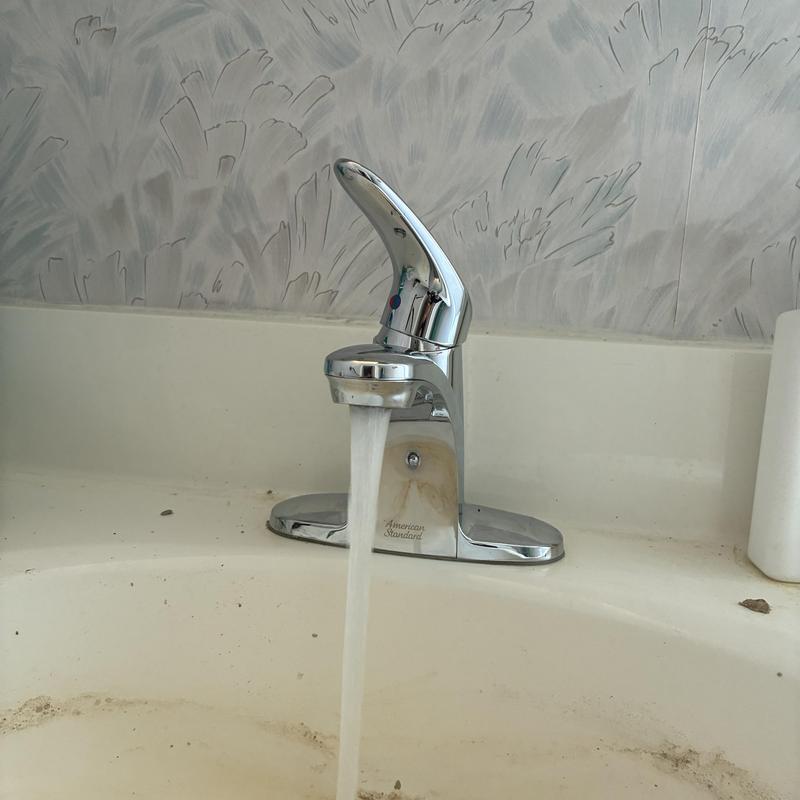 American Standard basin faucet with running water