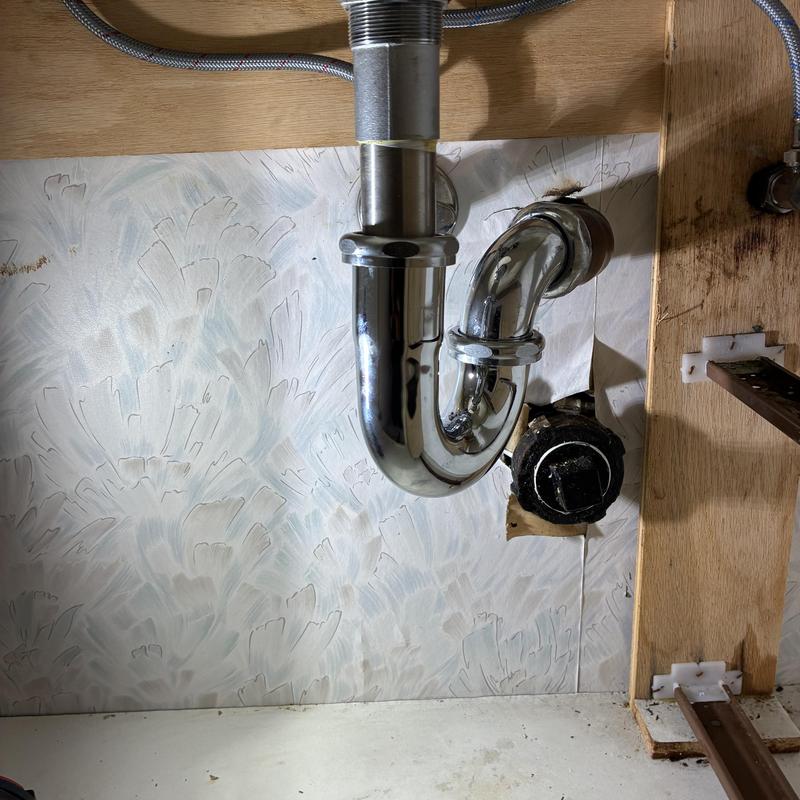 P-trap and drain pipe under bathroom basin