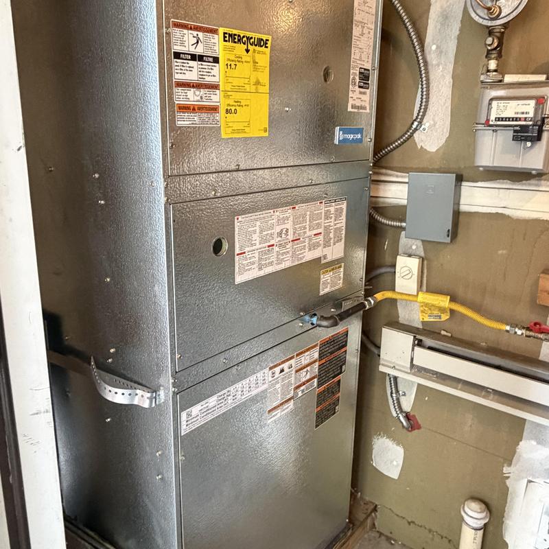 Gas furnace unit with energy guide label and piping
