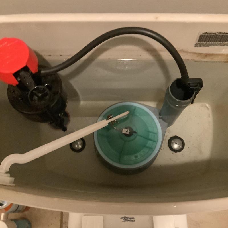 Toilet flush valve and fill valve inside tank