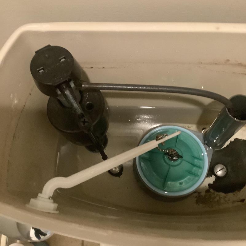 Toilet flush valve and fill valve inside tank