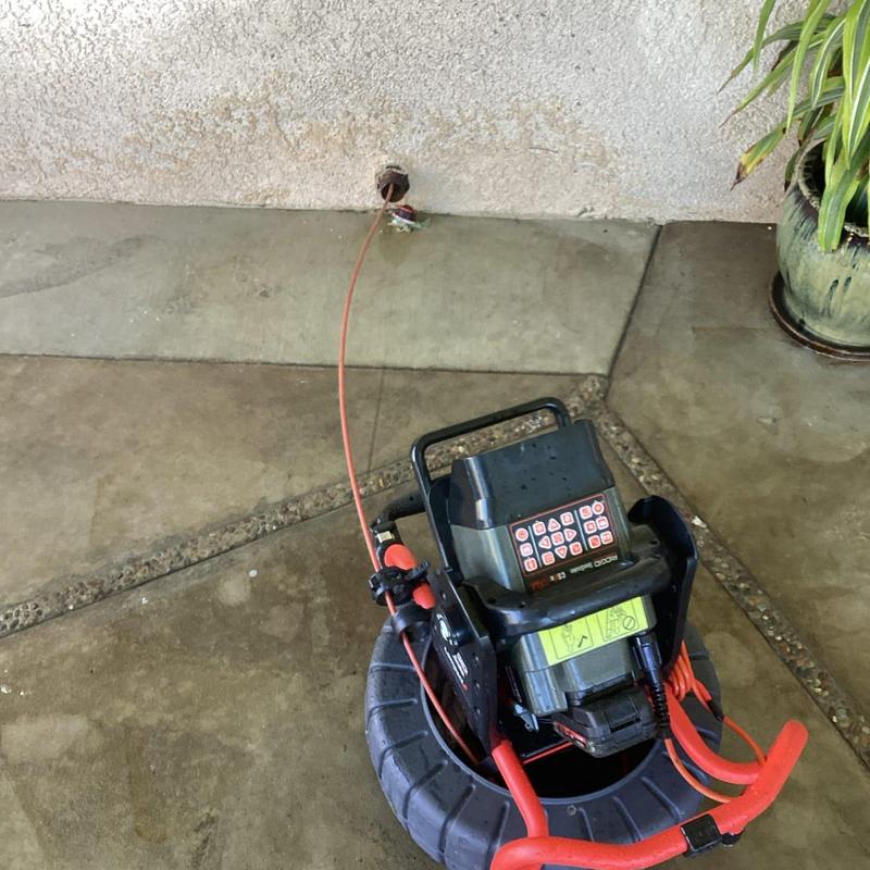 Kitchen drain line camera inspection device in use