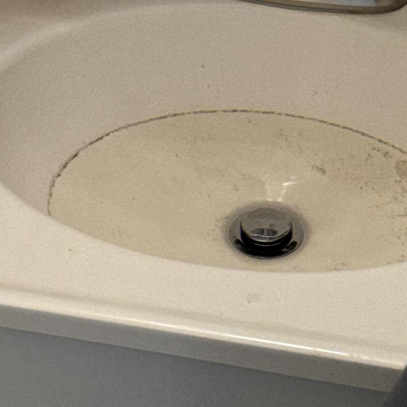 Bathroom sink drain with clogged pop-up assembly Bathroom sink drain with clogged pop-up assembly