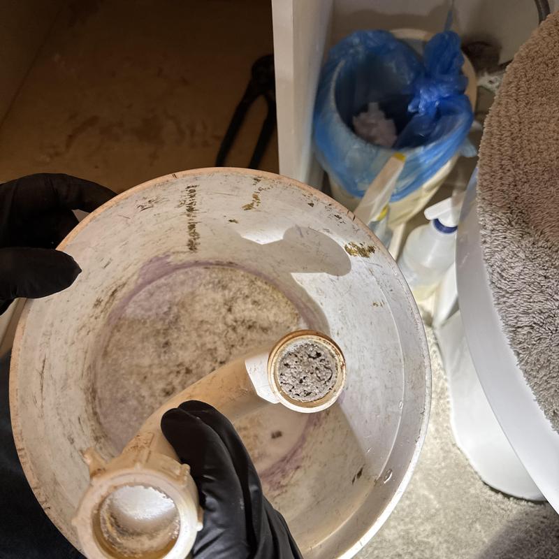 Bathroom sink P-trap clogged with hardened chemical residue Bathroom sink P-trap clogged with hardened chemical residue