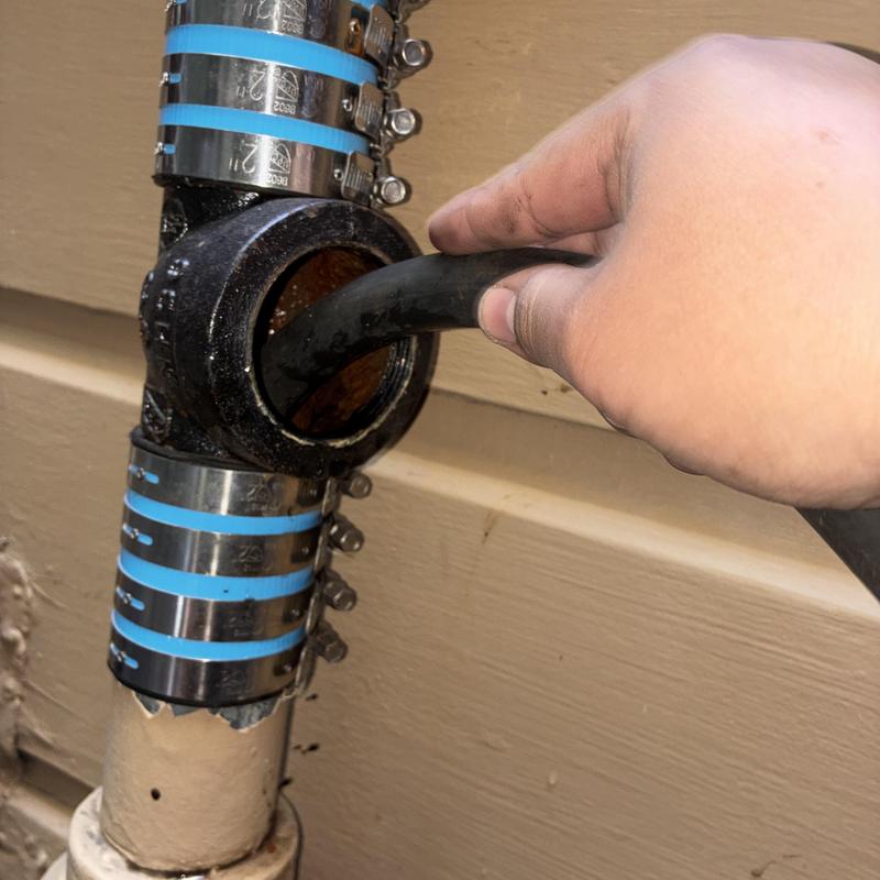 Drain stack cable inserted for buildup removal