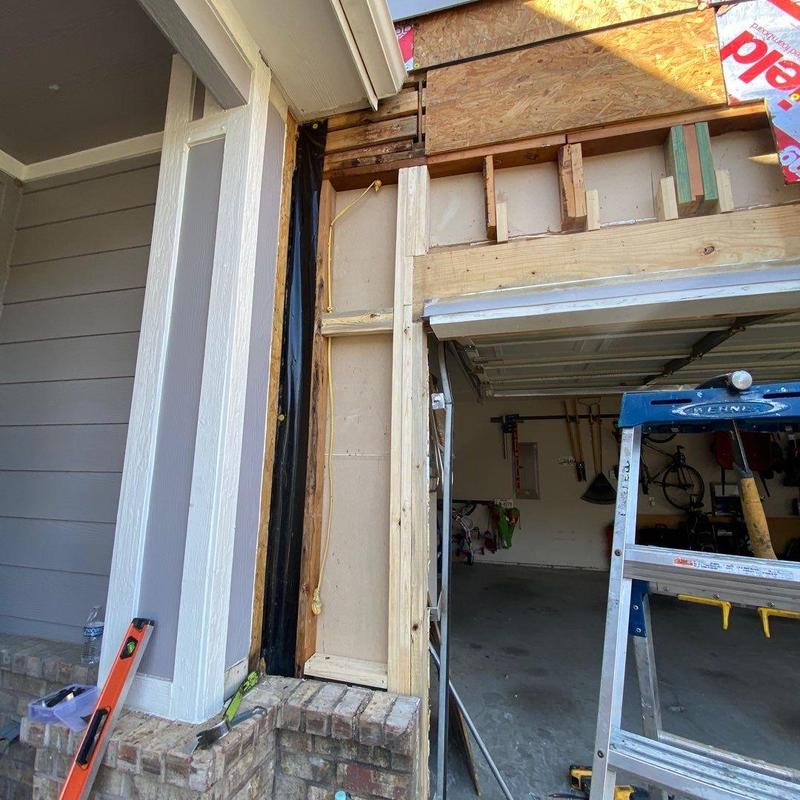 Garage siding framing replacement with new vapor barrier