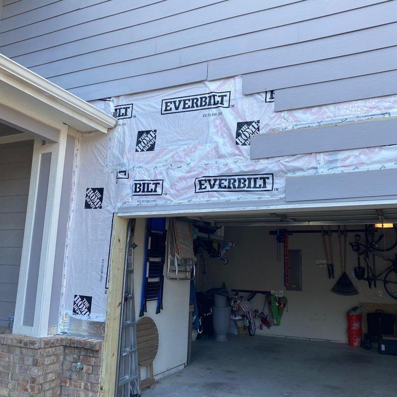 Garage siding replacement with new vapor barrier in McKinney