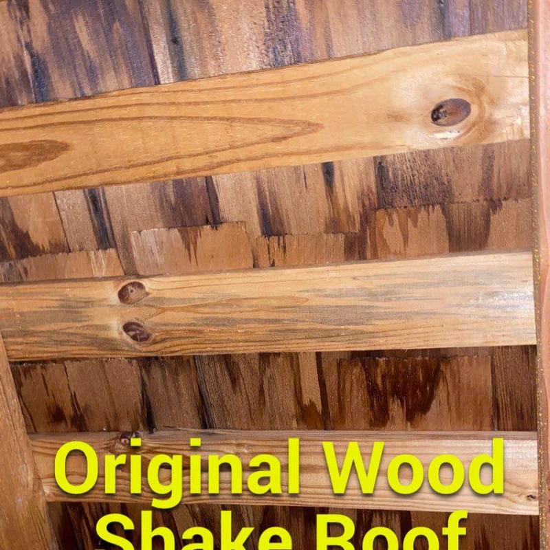 Wood shake roof showing original installation layers Wood shake roof showing original installation layers