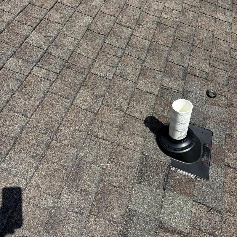 Pipe boot and shingle roof repair detail
