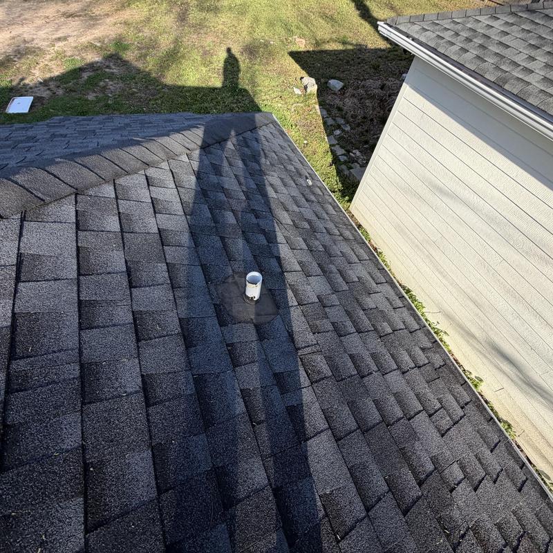 Missing pipe boot on charcoal shingle roof inspection