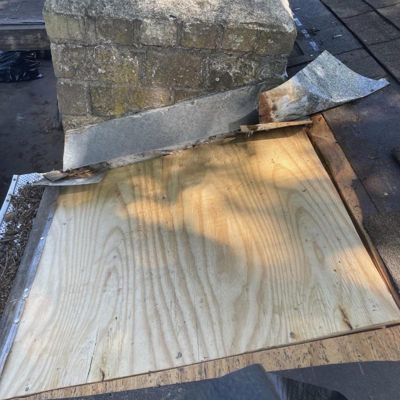 Chimney flashing and plywood roof decking repair