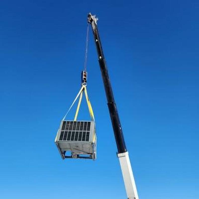 Goodman R32 3 ton HVAC unit lifted by crane on roof