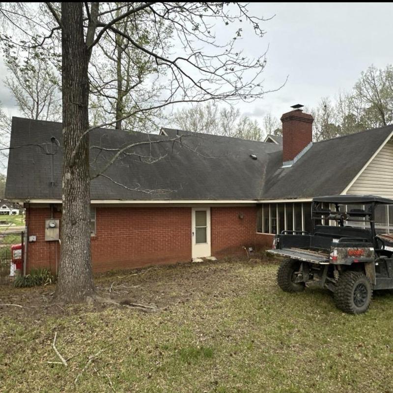 Asphalt shingle roof inspection at brick house
