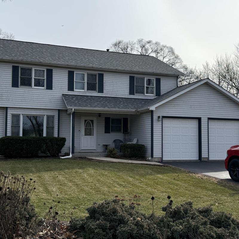 Atlas Pinnacle Pristine asphalt roof on two-story house