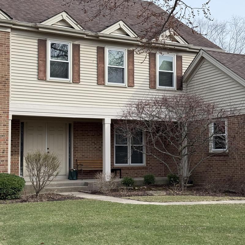 Soffit and fascia system on two-story house exterior