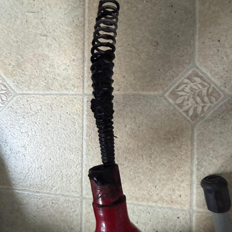 Bathroom sink drain snake with hair and grease buildup Bathroom sink drain snake with hair and grease buildup