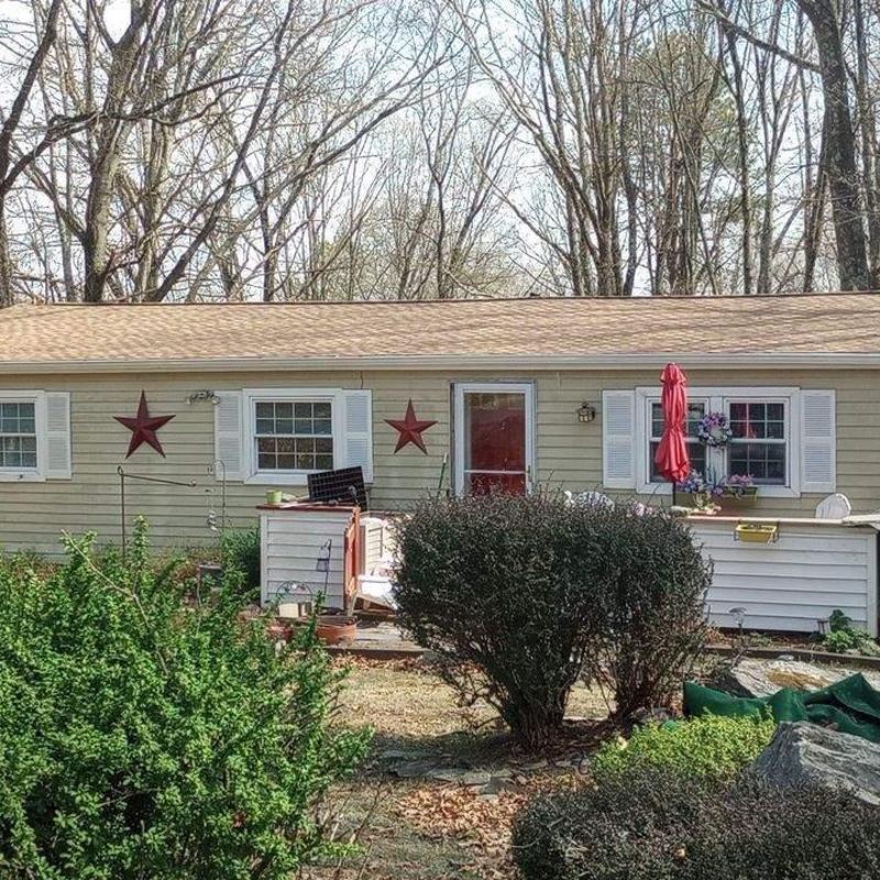 Roof shingles replacement on single-story home exterior
