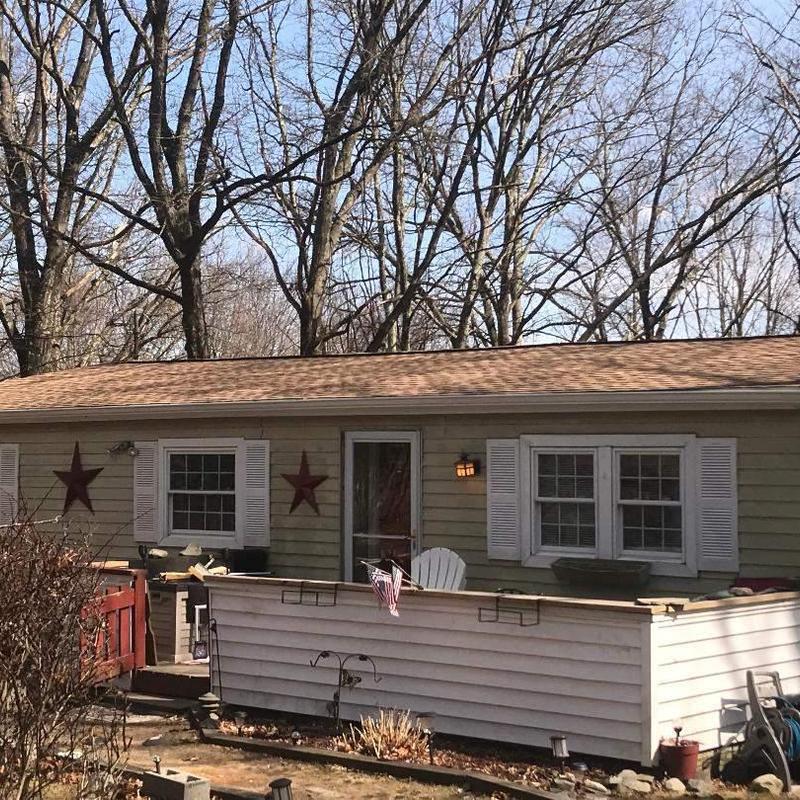 Roof shingles replacement on single-story home exterior