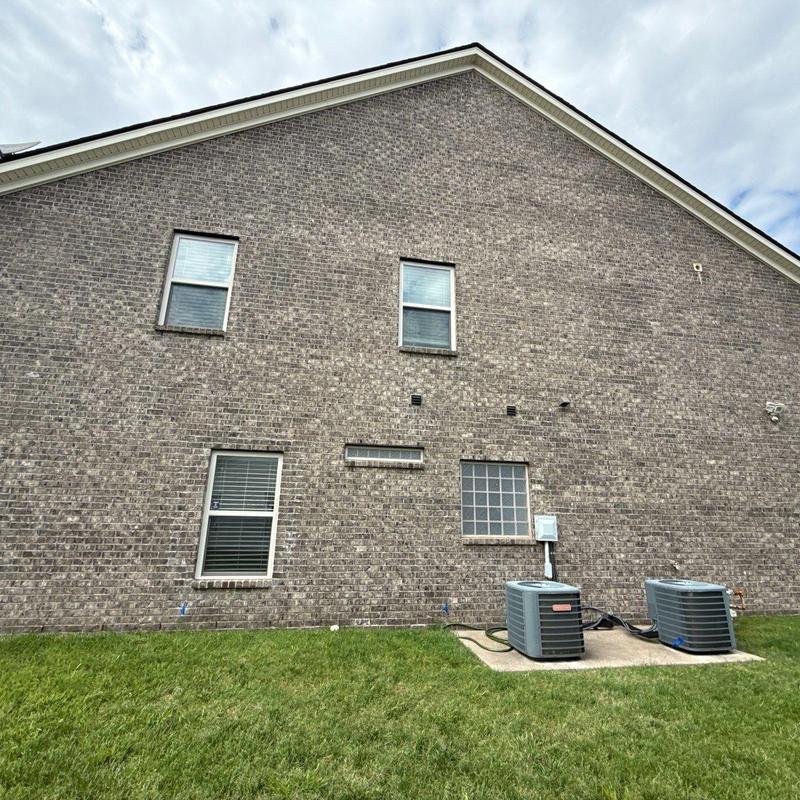 HVAC units outside brick residential building