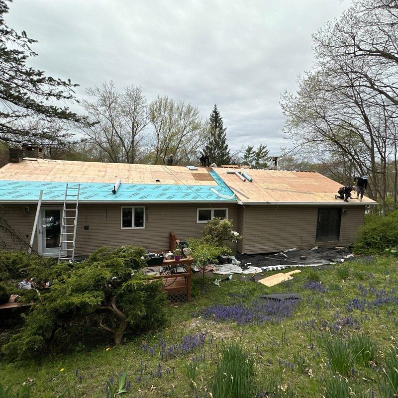 Plywood roof sheathing installation on residential house