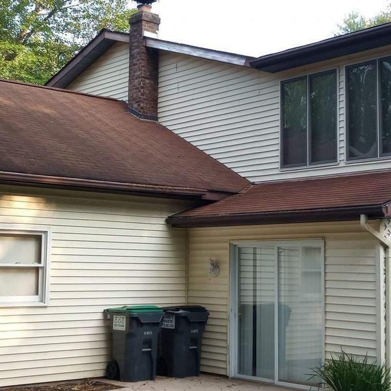 Asphalt shingle roof on residential house exterior