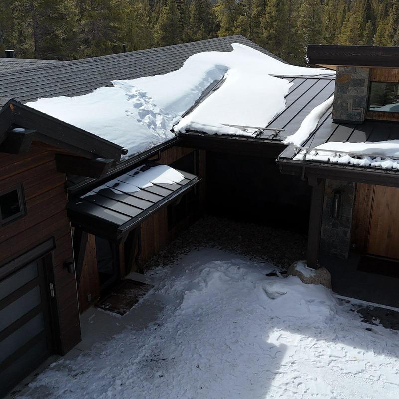 Metal roof and heat tape with snow buildup Metal roof and heat tape with snow buildup