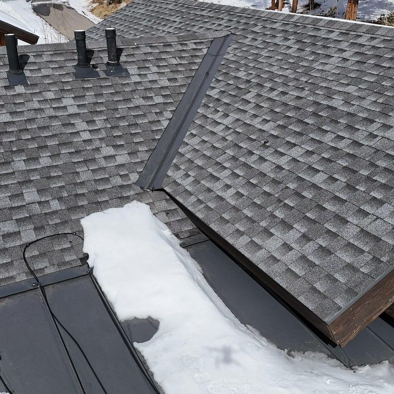 Asphalt shingle and metal roof with snow and heat tape Asphalt shingle and metal roof with snow and heat tape