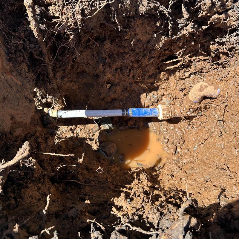 Main water line leak repair at meter in muddy soil