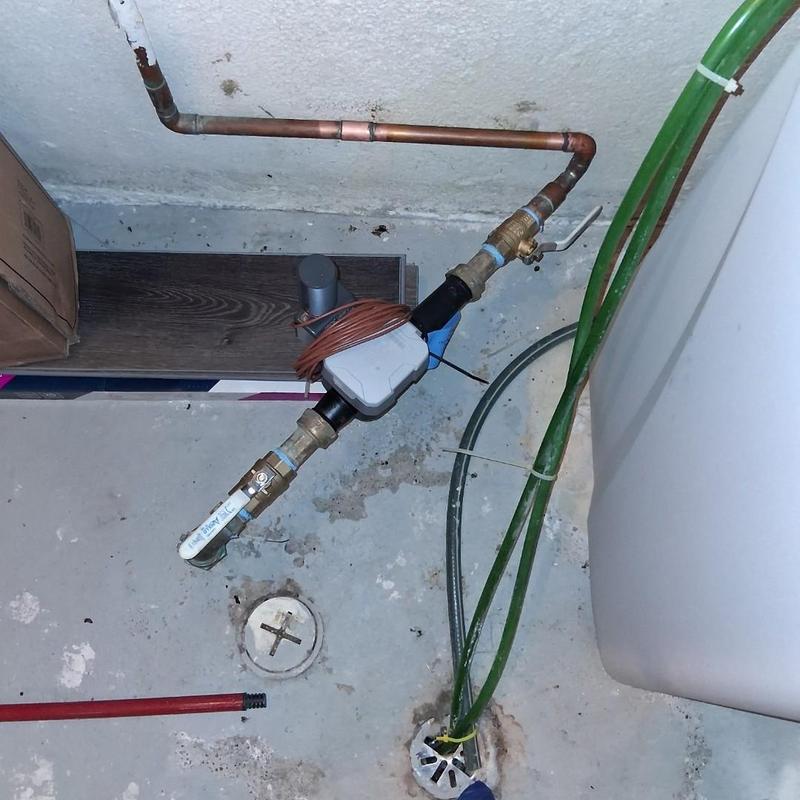 Water meter valves with attached wiring and pipes