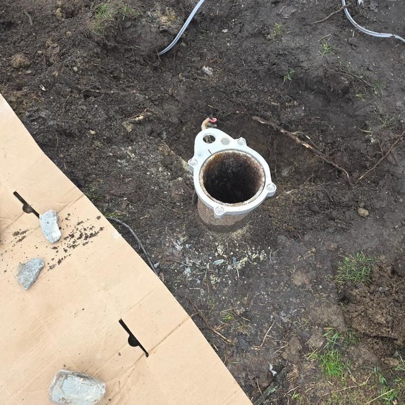 Deep well casing with electrical wiring exposed outdoors