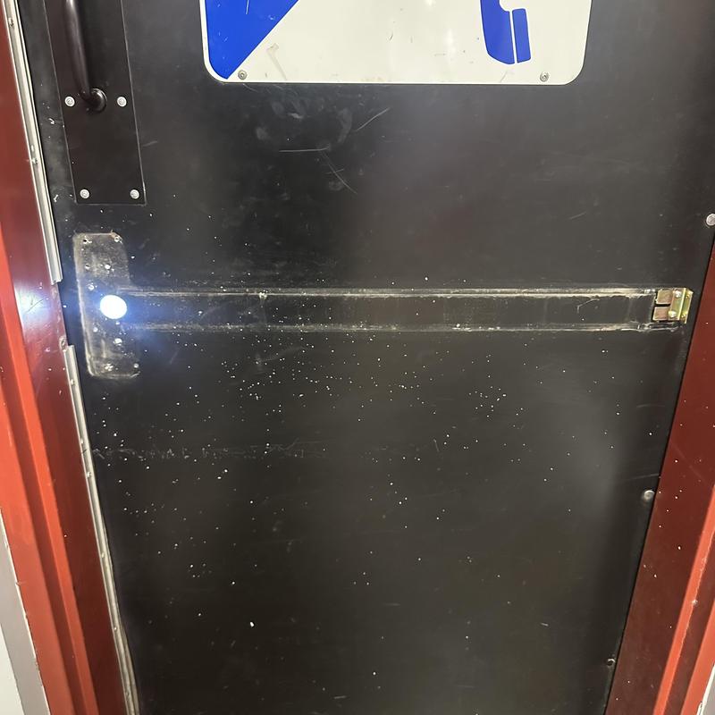 Exit device on black commercial door with locking lever