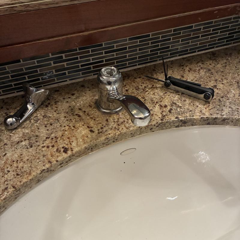 Kitchen faucet stems replacement with tools on counter
