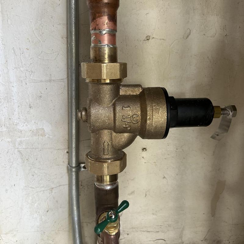 Pressure reducing valve with hose bib installation