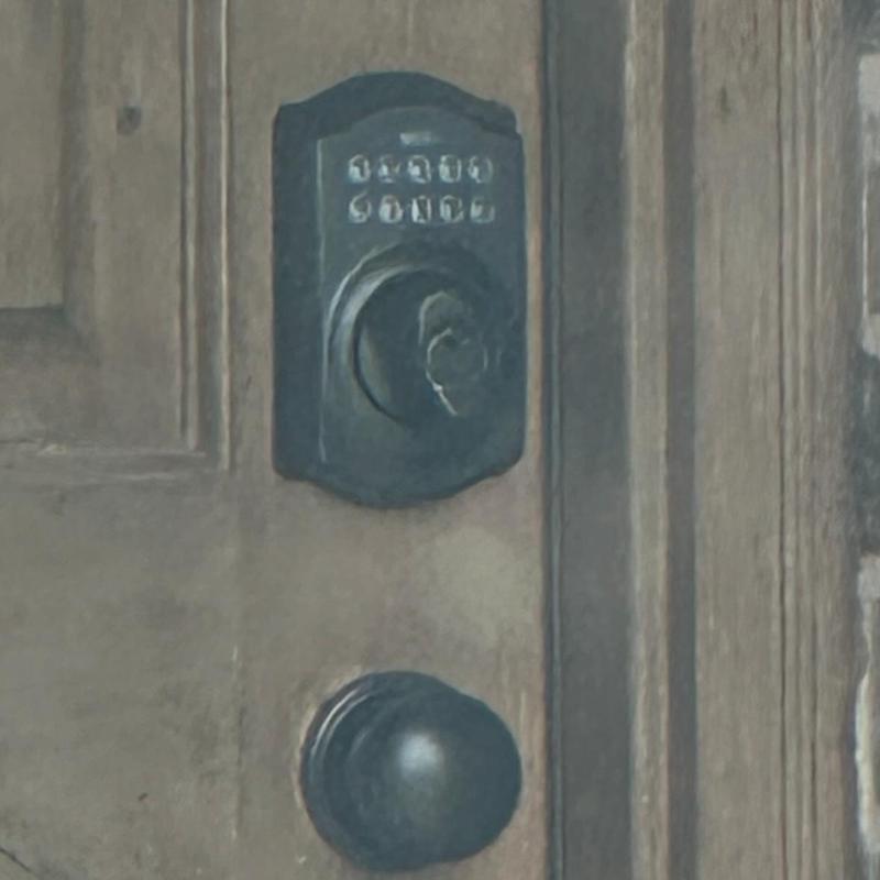 Keypad deadbolt lock on wooden front door