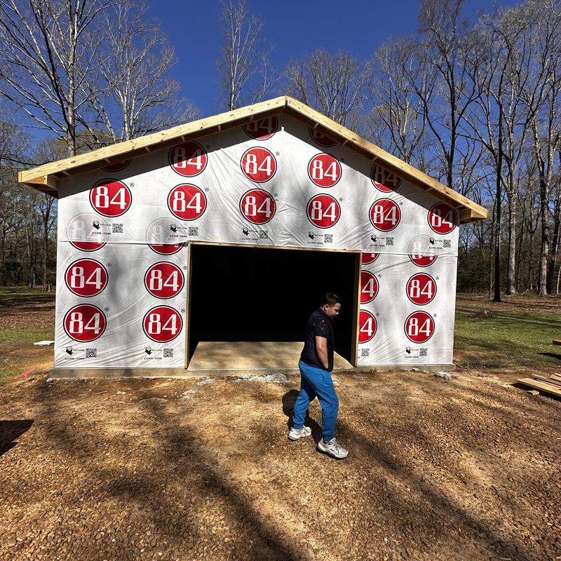 Wall sheathing installation on new construction shop