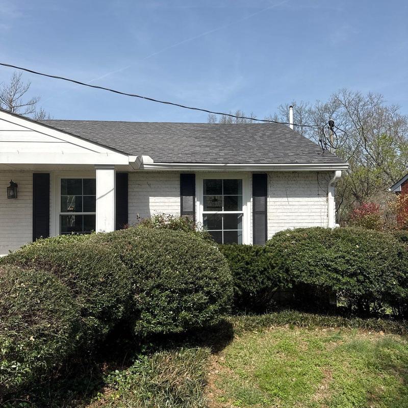 Asphalt shingle roof with gutter and window trim