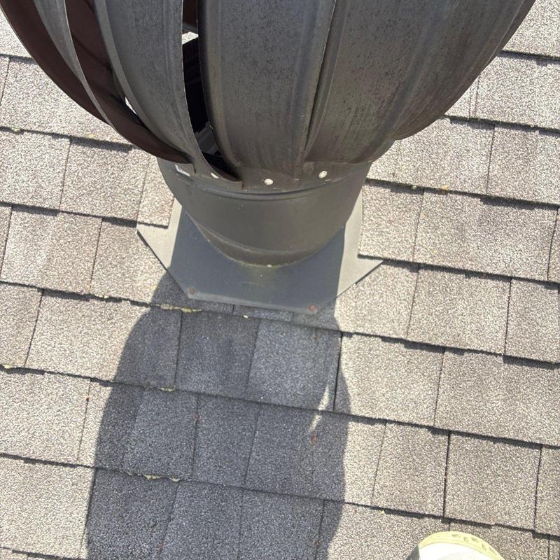 Roof vent with exposed fasteners on asphalt shingles