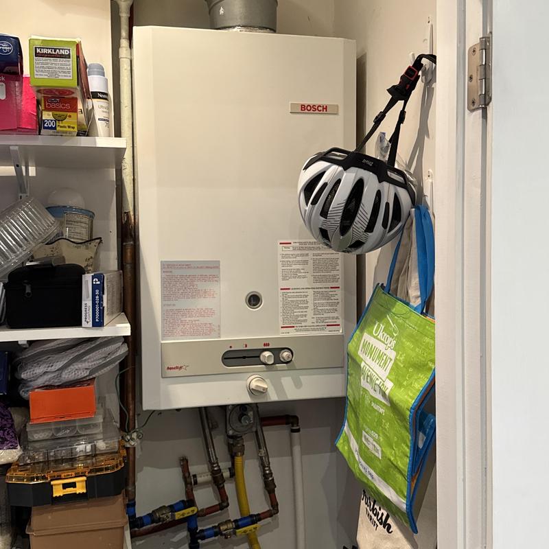 Bosch tankless water heater in utility closet