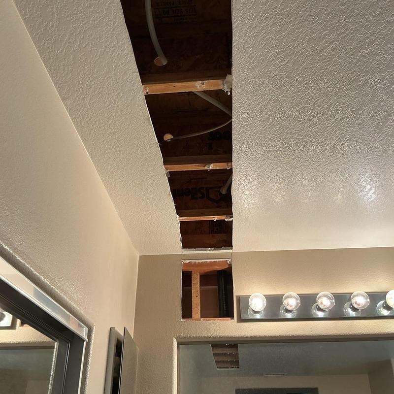Master shower plumbing reroute with ceiling access cutout