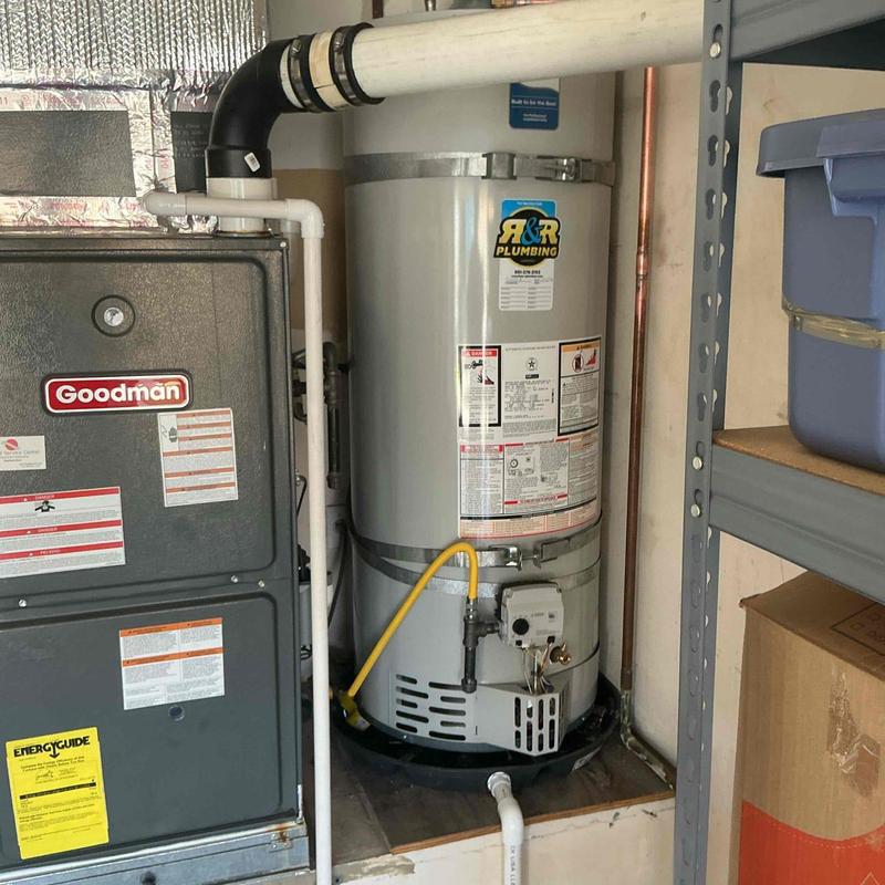 Water heater with gas line and catch pan installation