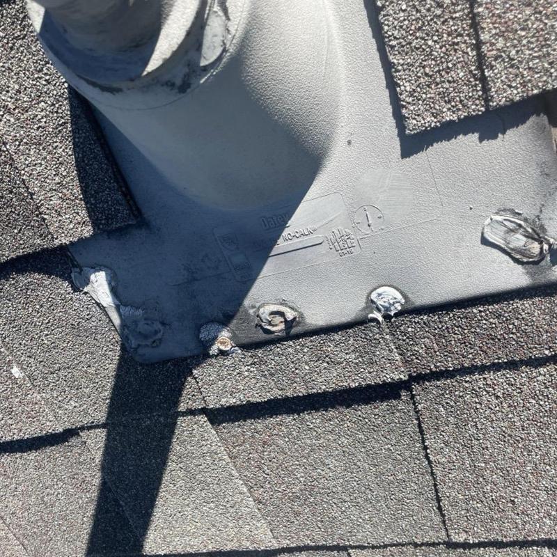 Roof vent pipe flashing with exposed nail heads and sealant issues