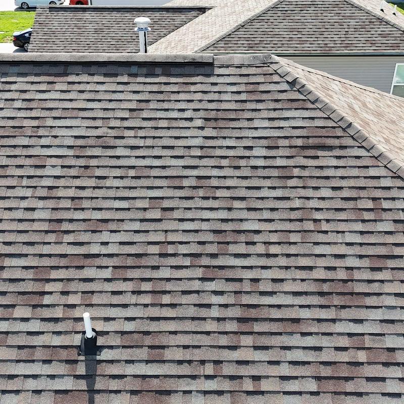 Asphalt shingle roof with hail damage inspection
