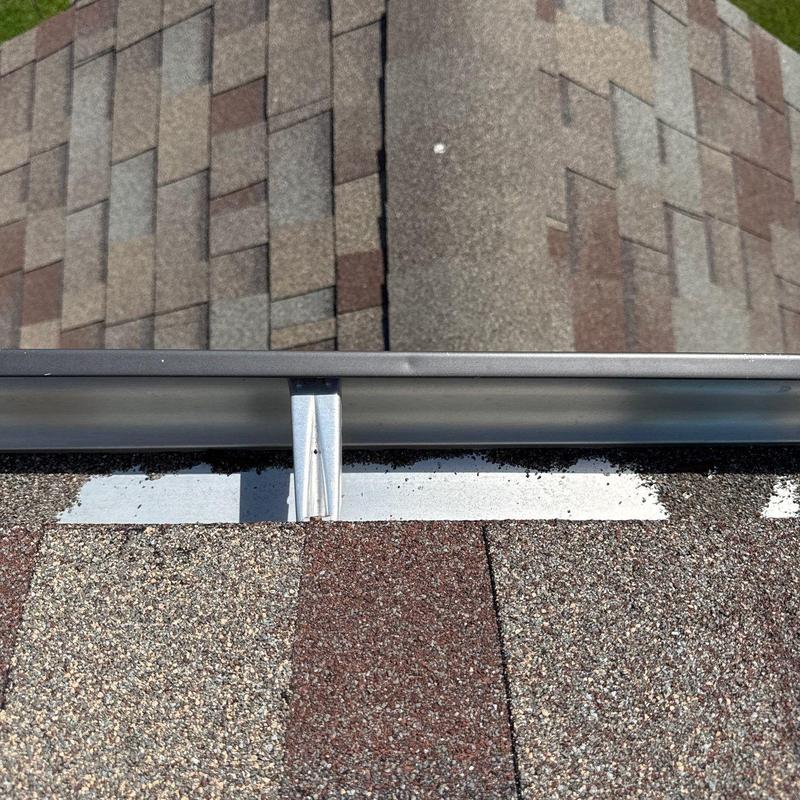Asphalt shingle roof edge with metal flashing detail